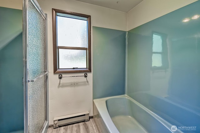 2781 Lake Whatcom Blvd, Bellingham, WA 98229 - bathroom featuring a baseboard radiator, a shower with door, a tub to relax in, and wood finished floors