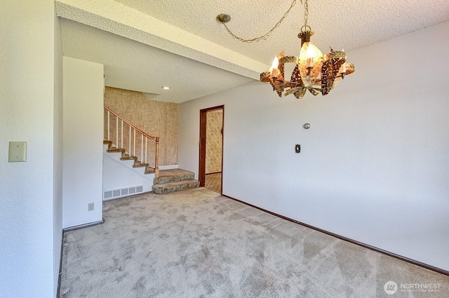 2781 Lake Whatcom Blvd, Bellingham, WA 98229 - entrance foyer featuring stairs, carpet flooring, a chandelier, and a textured ceiling
