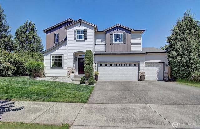 15202 NE 102nd Way, Vancouver, WA 98685 - traditional-style home featuring board and batten siding, a front lawn, concrete driveway, an attached garage, and stone siding