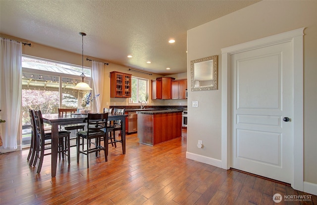 15202 NE 102nd Way, Vancouver, WA 98685 - dining room featuring wood finished floors, a textured ceiling, and recessed lighting
