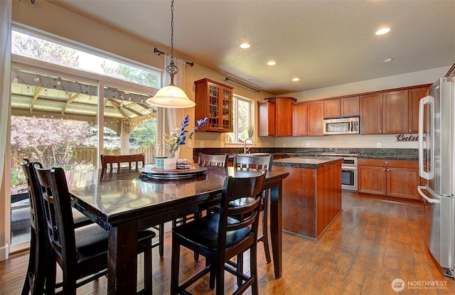 15202 NE 102nd Way, Vancouver, WA 98685 - kitchen with stainless steel appliances, brown cabinetry, recessed lighting, healthy amount of natural light, and a textured ceiling