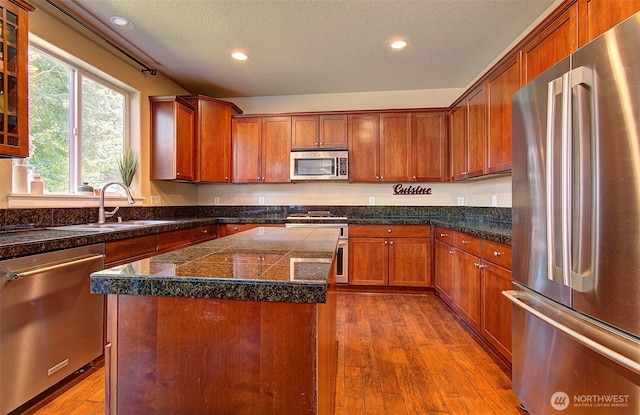 15202 NE 102nd Way, Vancouver, WA 98685 - kitchen with appliances with stainless steel finishes, tile countertops, recessed lighting, dark wood-type flooring, and brown cabinetry