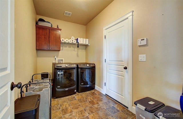 15202 NE 102nd Way, Vancouver, WA 98685 - laundry area featuring washing machine and clothes dryer, cabinet space, and stone finish flooring