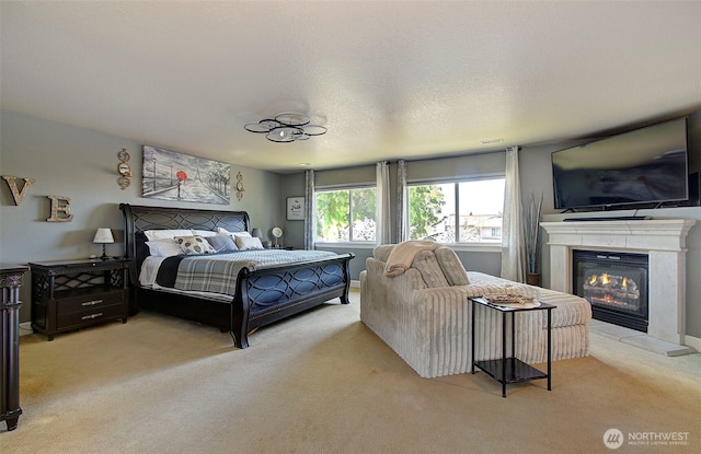 15202 NE 102nd Way, Vancouver, WA 98685 - bedroom featuring light carpet and a glass covered fireplace