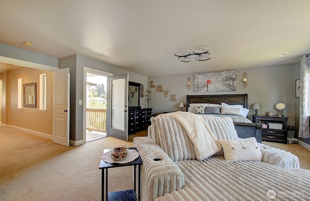 15202 NE 102nd Way, Vancouver, WA 98685 - bedroom with light colored carpet, access to exterior, and a textured ceiling