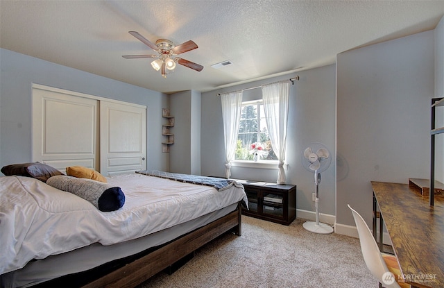 15202 NE 102nd Way, Vancouver, WA 98685 - bedroom with a closet, light colored carpet, ceiling fan, and a textured ceiling