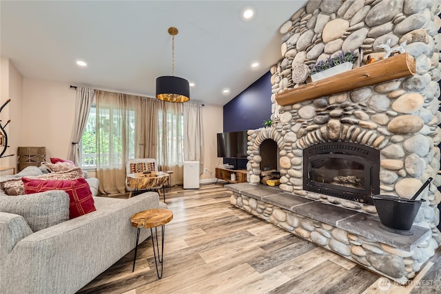 7547 NE 200 NE, Kenmore, WA 98028 - living area featuring wood finished floors, a stone fireplace, recessed lighting, and lofted ceiling
