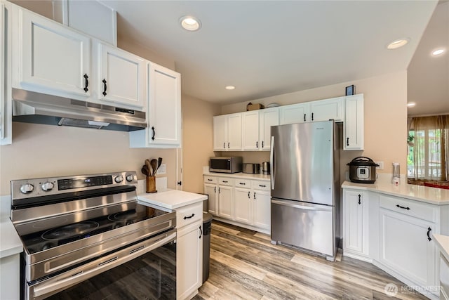 7547 NE 200 NE, Kenmore, WA 98028 - kitchen with appliances with stainless steel finishes, exhaust hood, light countertops, white cabinetry, and recessed lighting