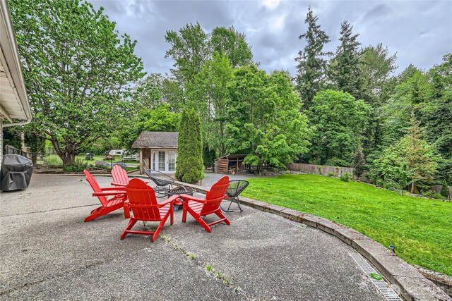 7547 NE 200 NE, Kenmore, WA 98028 - view of patio / terrace featuring area for grilling, french doors, an outdoor structure, and a fire pit