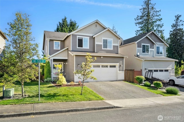 4915 NE 5th St, Renton, WA 98059 - craftsman-style home featuring an attached garage, driveway, and a front yard