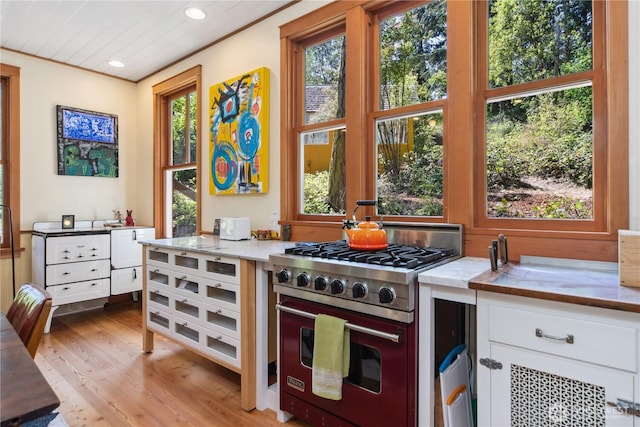 3422 Copper St, Port Townsend, WA 98368 - kitchen with designer stove, healthy amount of natural light, white cabinets, recessed lighting, and light wood-style flooring