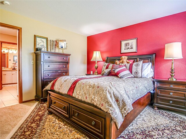 4425 65th St E, Tacoma, WA 98443 - carpeted bedroom featuring ensuite bath and tile patterned flooring