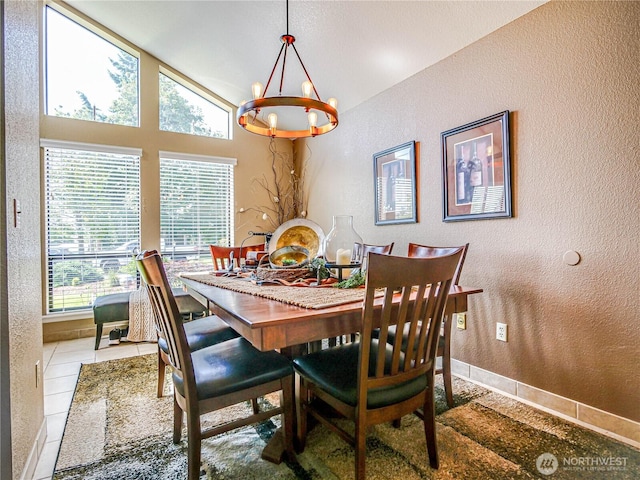 4425 65th St E, Tacoma, WA 98443 - tiled dining space featuring a textured wall, plenty of natural light, a chandelier, and lofted ceiling
