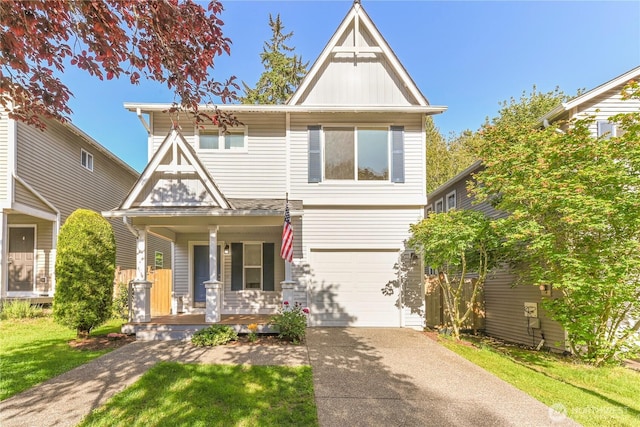 2413 106th Dr SE, Lake Stevens, WA 98258 - view of front facade featuring a porch, a garage, and concrete driveway