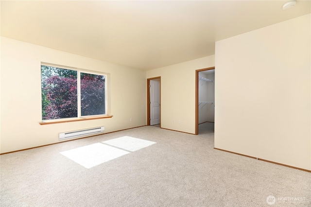 2413 106th Dr SE, Lake Stevens, WA 98258 - spare room with baseboard heating, baseboards, light colored carpet, and a smoke detector