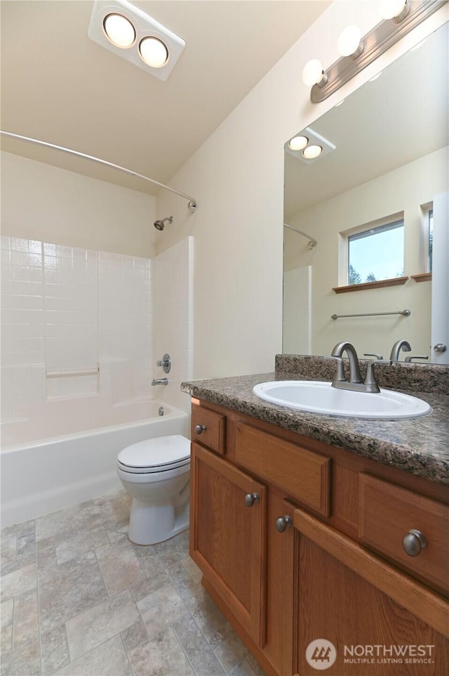 2413 106th Dr SE, Lake Stevens, WA 98258 - bathroom featuring  shower combination, vanity, toilet, and stone finish floors