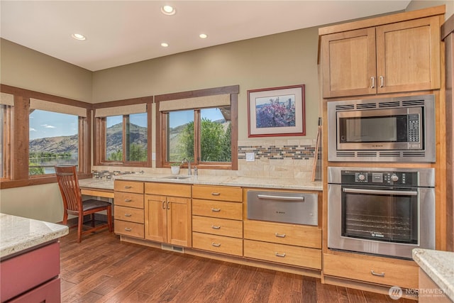 24386 US Highway 97, Chelan, WA 98816 - kitchen featuring appliances with stainless steel finishes, a warming drawer, healthy amount of natural light, a sink, and recessed lighting