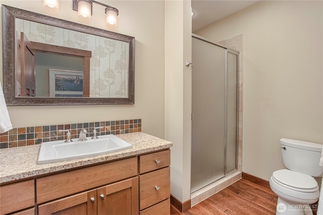 24386 US Highway 97, Chelan, WA 98816 - full bath featuring wood finished floors, vanity, a stall shower, and toilet