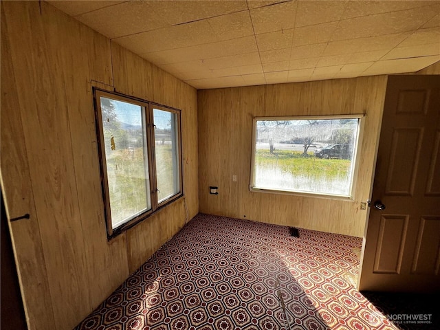 2405 Elmway, Okanogan, WA 98840 - spare room featuring healthy amount of natural light and wooden walls