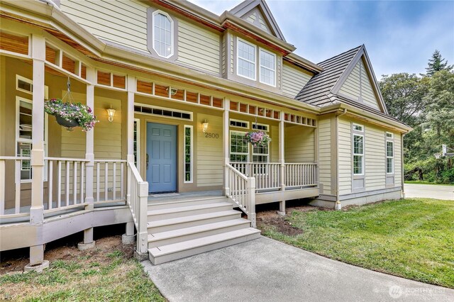 2800 Cliff St, Port Townsend, WA 98368 - view of front of home featuring a porch and a front lawn
