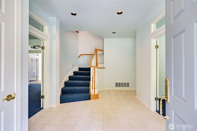 2800 Cliff St, Port Townsend, WA 98368 - tiled entryway with stairs, carpet floors, and recessed lighting