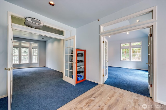 2800 Cliff St, Port Townsend, WA 98368 - empty room featuring french doors, carpet, recessed lighting, and wood finished floors