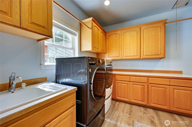 2800 Cliff St, Port Townsend, WA 98368 - laundry area with cabinet space, light wood-type flooring, separate washer and dryer, and recessed lighting