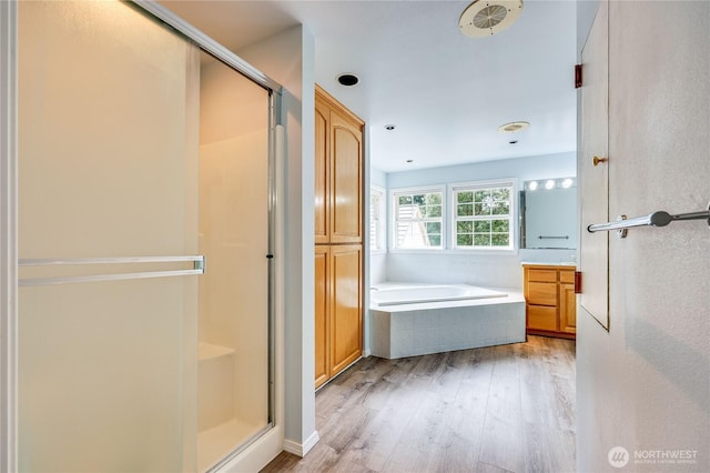 2800 Cliff St, Port Townsend, WA 98368 - full bathroom with a shower stall, a bath, wood finished floors, and vanity