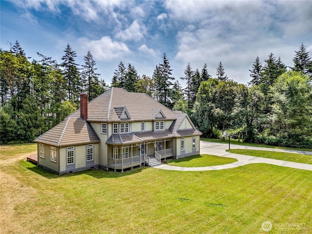 2800 Cliff St, Port Townsend, WA 98368 - back of house featuring a porch, a chimney, and a yard