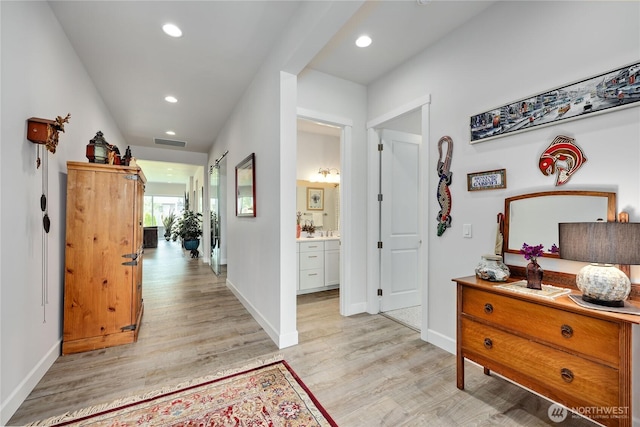 4689 Petrel St, Port Townsend, WA 98368 - hall with light wood-style floors and recessed lighting