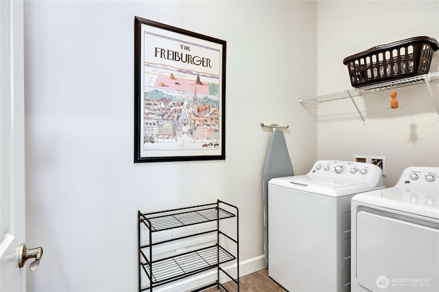 4689 Petrel St, Port Townsend, WA 98368 - washroom with washing machine and dryer and light wood-type flooring