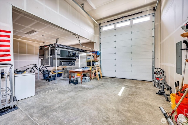 4689 Petrel St, Port Townsend, WA 98368 - garage featuring washer / dryer and electric panel