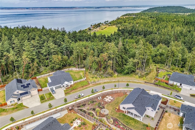 4689 Petrel St, Port Townsend, WA 98368 - aerial perspective of suburban area featuring a nearby body of water and a heavily wooded area