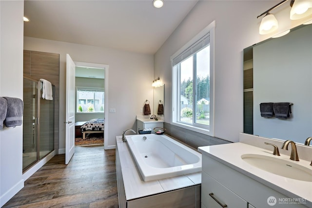 4689 Petrel St, Port Townsend, WA 98368 - bathroom featuring healthy amount of natural light, two vanities, a bath, a shower stall, and recessed lighting