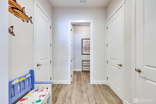 4689 Petrel St, Port Townsend, WA 98368 - corridor with light wood-style flooring and baseboards