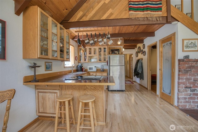 1211 E Market St, Aberdeen, WA 98520 - kitchen featuring freestanding refrigerator, wooden ceiling, a peninsula, a sink, and white microwave