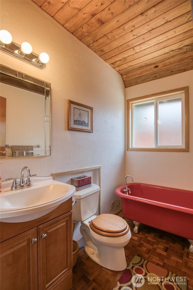 1211 E Market St, Aberdeen, WA 98520 - full bath with wood ceiling, a freestanding tub, lofted ceiling, toilet, and vanity