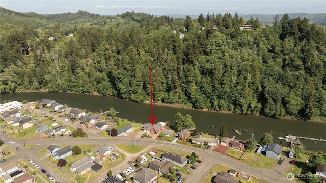 1211 E Market St, Aberdeen, WA 98520 - aerial view of property's location with a heavily wooded area, a nearby body of water, and nearby suburban area