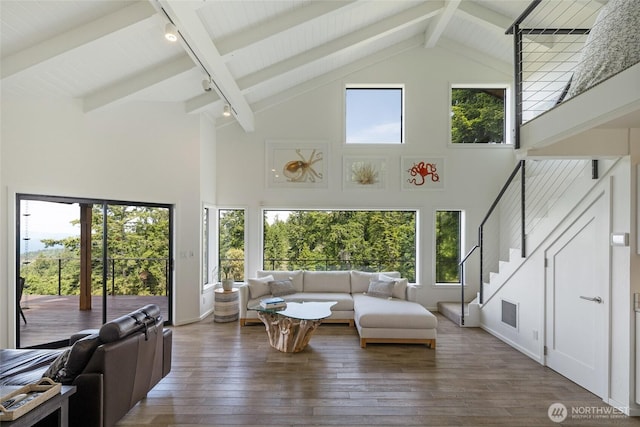 2000 Mount Dallas Rd, Friday Harbor, WA 98250 - living area with high vaulted ceiling, wood-type flooring, beamed ceiling, stairway, and healthy amount of natural light