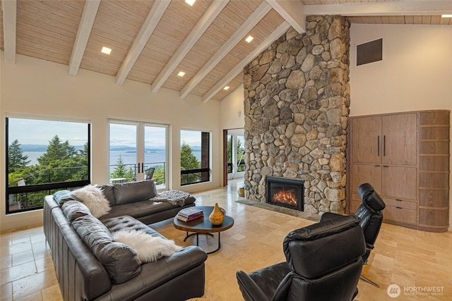 2000 Mount Dallas Rd, Friday Harbor, WA 98250 - living area featuring high vaulted ceiling, a stone fireplace, a wooden ceiling with exposed beams, and stone tile flooring
