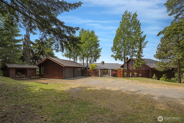 2000 Mount Dallas Rd, Friday Harbor, WA 98250 - view of grassy yard with an outbuilding, a detached garage, and dirt driveway