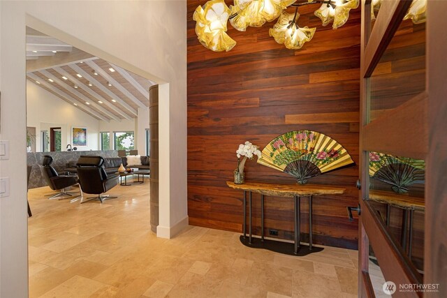 2000 Mount Dallas Rd, Friday Harbor, WA 98250 - hallway with high vaulted ceiling, wooden walls, recessed lighting, a chandelier, and an accent wall