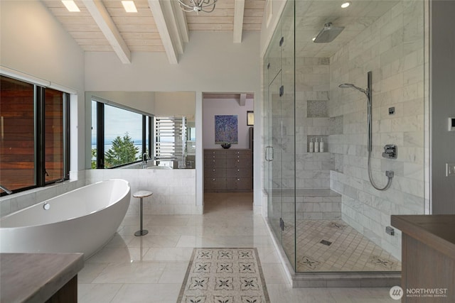2000 Mount Dallas Rd, Friday Harbor, WA 98250 - bathroom with a shower stall, a freestanding tub, beamed ceiling, vanity, and tile walls