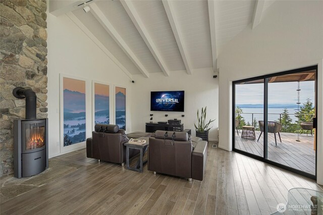 2000 Mount Dallas Rd, Friday Harbor, WA 98250 - living room with wood finished floors, beamed ceiling, a wood stove, and high vaulted ceiling