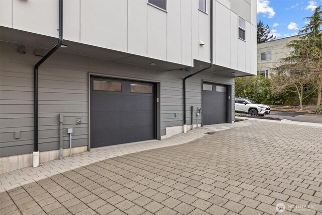 11232 Corliss Ave N, Seattle, WA 98133 - garage featuring decorative driveway