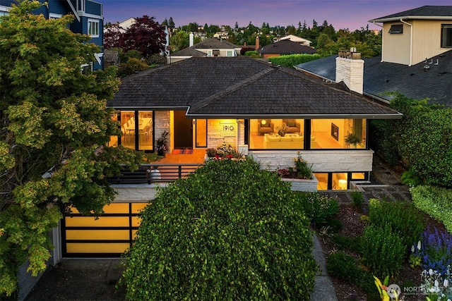 1910 Edgemont Pl W, Seattle, WA 98199 - view of front of property with stone siding and a chimney