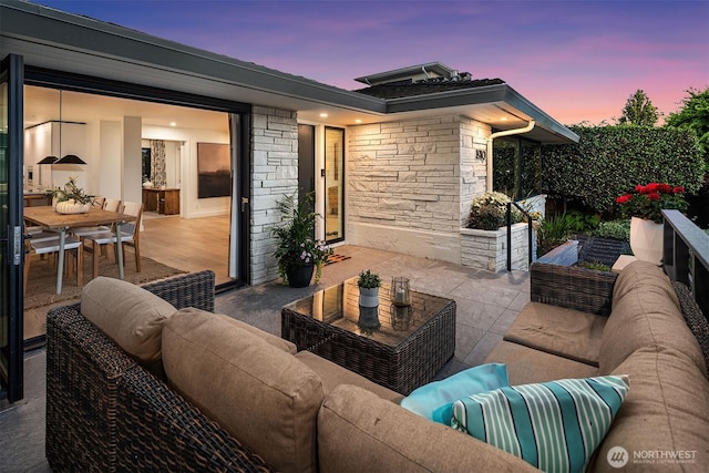 1910 Edgemont Pl W, Seattle, WA 98199 - patio terrace at dusk with outdoor lounge area, a patio, and outdoor dining area