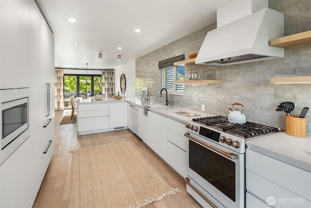 1910 Edgemont Pl W, Seattle, WA 98199 - kitchen with high end white range oven, open shelves, premium range hood, modern cabinets, and stainless steel microwave