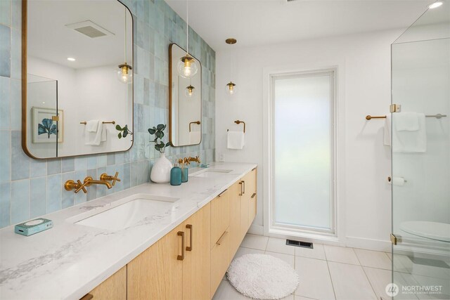 1910 Edgemont Pl W, Seattle, WA 98199 - full bathroom featuring tile patterned floors, double vanity, and tasteful backsplash