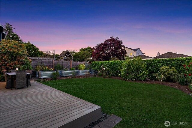 1910 Edgemont Pl W, Seattle, WA 98199 - fenced backyard featuring a garden, a deck, and outdoor dining space